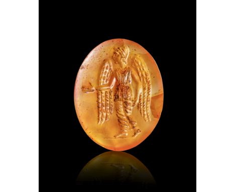 A ROMAN CARNELIAN INTAGLIO WITH A STANDING FIGURE OF LADY POSING AS AURA, 2ND - 3RD CENTURY A.D.    L: 2.2cm&nbsp;