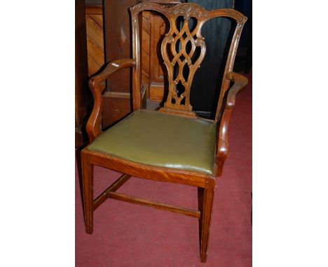 A collection of five Chippendale style mahogany open elbow chairs, each with green leather upholstered seats