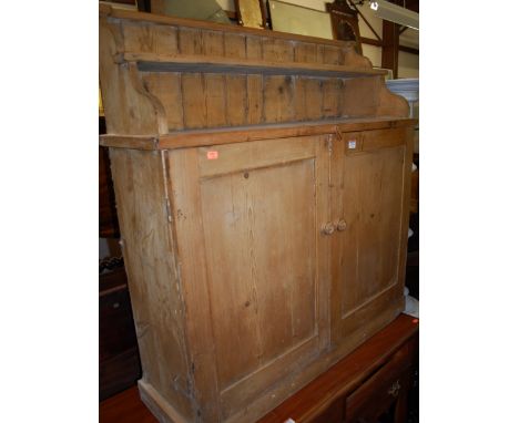 A Victorian pine double door side cupboard, having single shelf raised superstructure, w.100cm