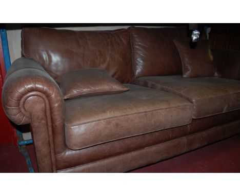 A modern tan leather three seater sofa, width 200cm