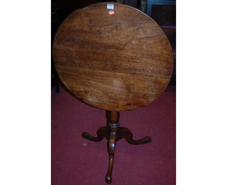 A circa 1800 provincial oak circular tilt top tripod table