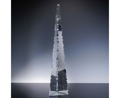 Striking contemporary crystal obelisk sculpture by Baccarat, France. This towering form features precision-cut facets with sy