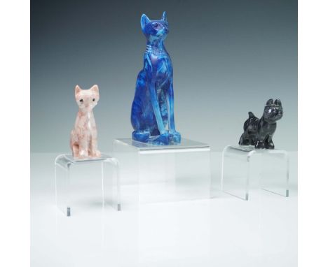 Charming trio of carved stone cats and dog figurines, each rendered in a distinct stone and style. The group includes a regal