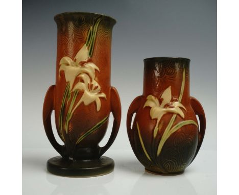 Charismatic pair of pottery vessels, each adorned with blossoms of yellow on a textured green to orange ground with rippling 