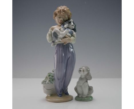 Two Lladro porcelain figurines including My Buddy 1007609, featuring a boy in striped pants lovingly cradling a puppy, and A 