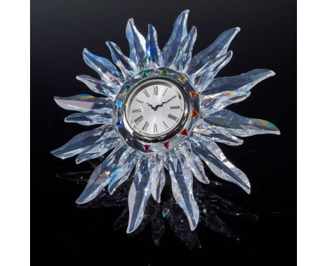 Striking Swarovski Solaris table clock designed by Adi Stocker, introduced in 1998 and retired in 2004. The piece features an