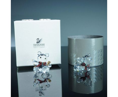 This collection includes two Swarovski Kris Bear figurines from the "When We Were Young" theme, both marked and housed in the