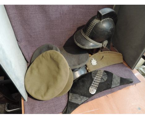 A Bicorne Hat having makers name H Poole &amp; Co, Saddlerow having white metal decorated badge, along with a black leather F
