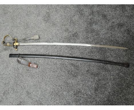 A German WW2 Officers Sword with metal scabbard, blade marked PUMA Solingen, on reverse No6, with Portepee Knot and leather h