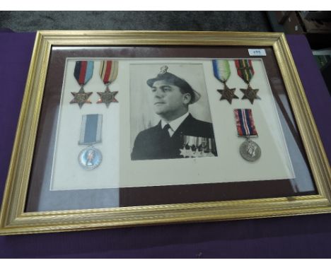 A framed and glazed Medal Display to JX158547 P/Off W.B.SMITH, HMS DRAKE, 39-45 Star, Africa Star, Atlantic Star and Pacific 