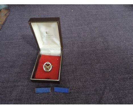 A WWI Austrian Army Pilot/Air Crew Badge with two blue collar tabs