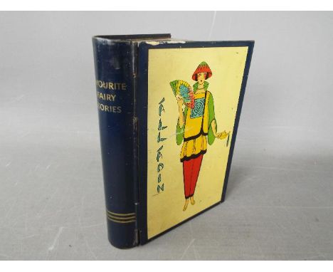 A Chad Valley novelty tinplate money box in the form of a book, titled 'Favourite Fairy Stories'