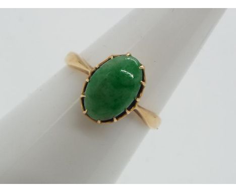 18 ct gold - a 18 ct gold ring set with jade oval stone, size N, approximate weight 2.20g