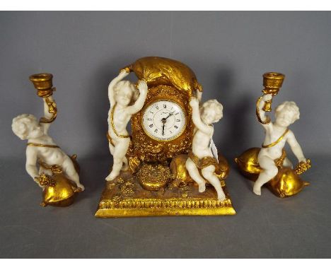 An Italian-styled clock set by Crosa, the gilded case of moulded resin with contrasting white to represent marble cherubs, ma
