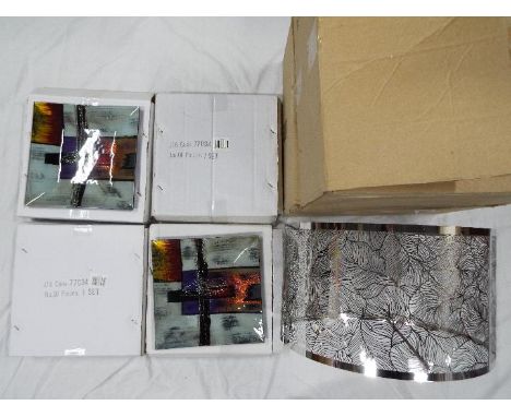 Unused Retail Stock - Two boxed silver coloured light shades and four sets of three decorative, graduated, glass dishes, all 