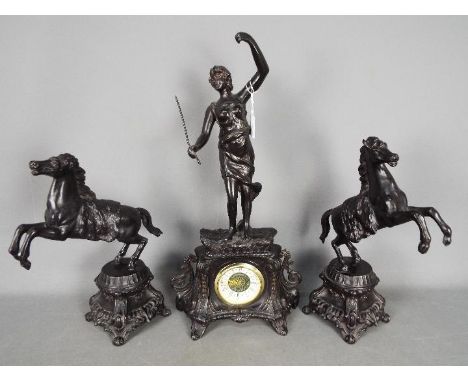 A cast metal mantel clock set, with a matched pair of rearing horses as side pieces, bronzed finish, mechanical movement sign