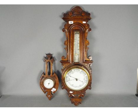 A highly carved oak cased banjo aneroid barometer, approx. 88 cm ( h ) and a further aneroid barometer with the glass a/f, ap