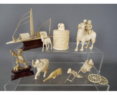 A small collection of early 20th century worked ivory pieces including model of a sampan, cylindrical trinket box, animal fig