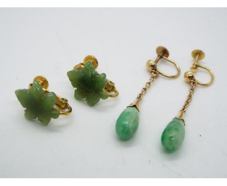 18 ct gold - a pair of 18 ct gold earrings set with Jade and a further pair of yellow metal earrings set with green hard ston