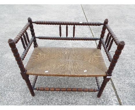 A small scale, twin bench seat with bobbin turned supports, approximately 75 cm x 76 cm x 42 cmCondition Report: Generally go