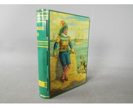 A Chad Valley novelty tinplate money box in the form of a book, titled 'Westward Ho'