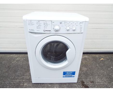 An Indesit freestanding washer dryer, model IWDC6125