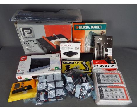 A collection of mixed tools and similar to include electric tile cutter, Black &amp; Decker jigsaw, Stanley plane and similar