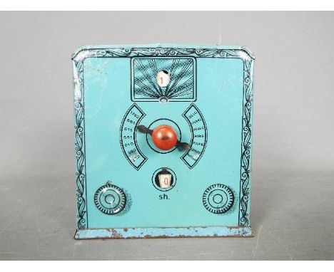 A vintage German tinplate money bank in the form of a valve radio, approximately 10.5 cm (h)