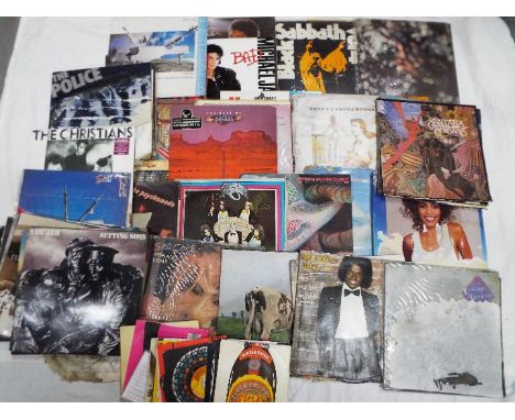 A collection of vinyl records, 12" and 7" to include Black Sabbath, Michael Jackson, Blondie, Elton John, Rod Stewart, The Po