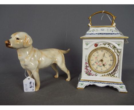 A Goebel figurine depicting a Labrador, approximately 15 cm (h) and a Franklin Mint porcelain mantel clock, approximately 22 