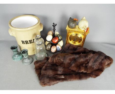 A mixed lot to include decorative stone eggs, candle holders, fur stole, mantel clock and similar.