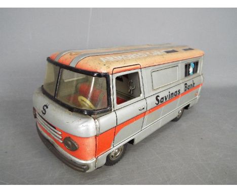 Hayashi (Japan) - An unboxed Hayashi (Japan) Tinplate Armoured Van Savings Bank. The friction driven savings bank is in silve