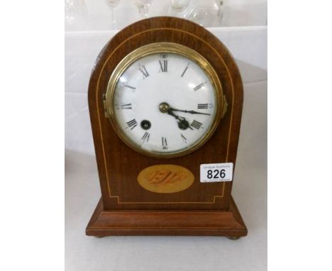 A mahogany 8 day mantel clock with shell inlay