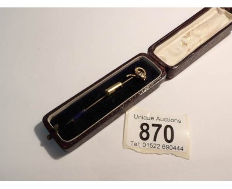 An exquisite cased gold 'serpent head' stick pin set with a good diamond