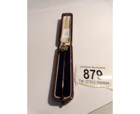 A cased gold Scottish stick pin set amethyst