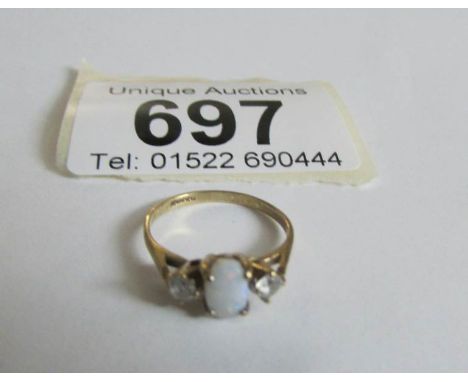 A 9ct gold and opal ring, size E