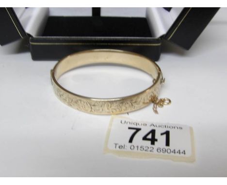 A 9ct gold bangle