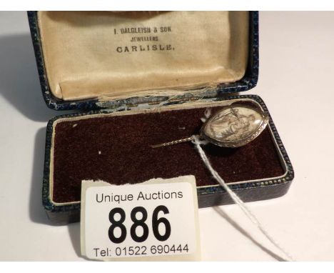 A 19th century gold metal stick pin with female and child painting, possibly on ivory