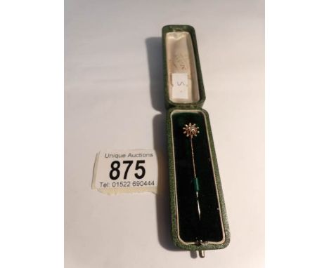 A fine cased gold stick pin set diamond