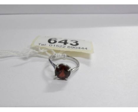 A single stone garnet ring set in 18ct white gold, size K