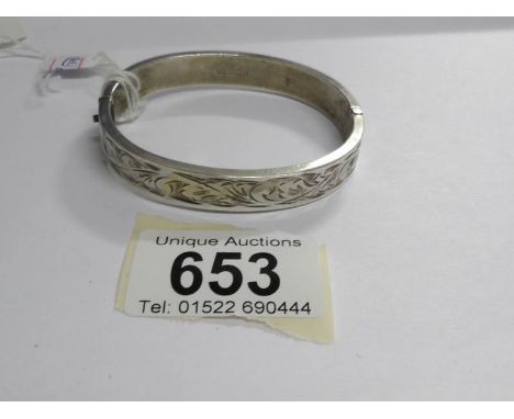 A silver bangle dated 1966, stamped C H Birmingham, possibly Charles Horner