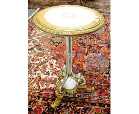 A cream and gilt tripod table, 76cm high by 46cm wide 