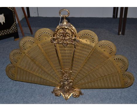 A 20th century fan shaped folding brass fireguard with carrying handle, height 79cm 