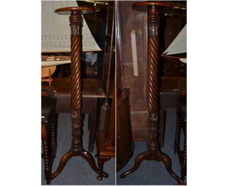 A pair of 19th century mahogany Wrythen-form torchere stands, on tripod bases, 51cm high (2) 