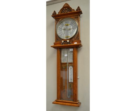 An oak Admiral Fitzroy Improved Torricelli barometer, retailed by F.H.Cousens, Hull, circa 1890, pediment with carved leaf de