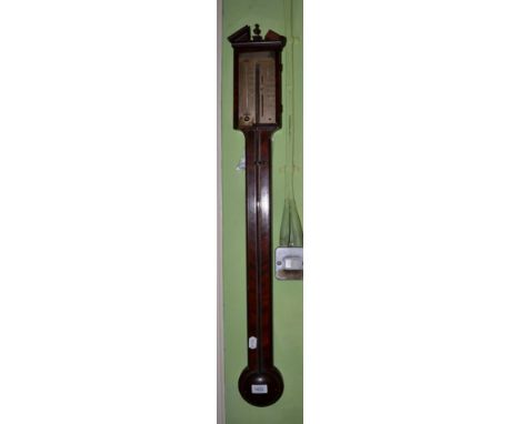 A mahogany stick barometer, signed Manticha & Co, circa 1820, broken arched pediment, exposed mercury tube with a single vern