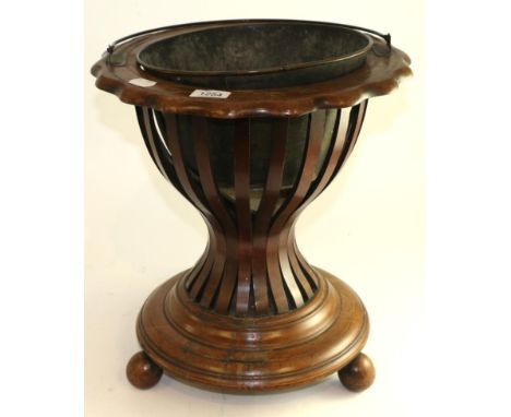 A late 19th century mahogany planter with carrying handle and slatted body, 41cm high 