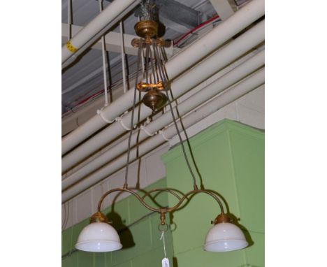 {} A vintage brass rise and fall two branch light fitment, maximum drop 120cm 