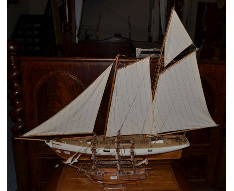 A Victorian style model of a pond yacht with linen sail and a cream painted hull, 130cm wide maximum and a scale model of an 