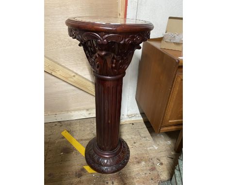 A large mahogany planter stand with a marble insert. 92cm tall. No shipping